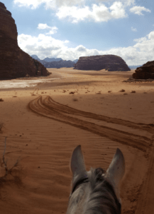 Dyenne Borst, on horseback in the desert, Wadi Rum