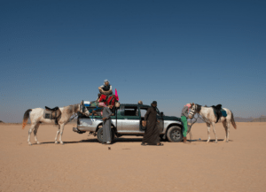 Imke Ligthart with the horses in the desert